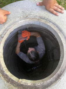Worker under Sewer Line