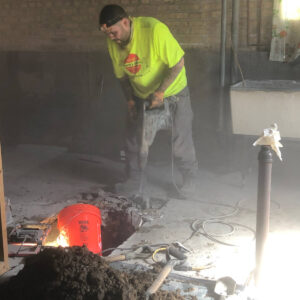 Worker Drilling the Floor