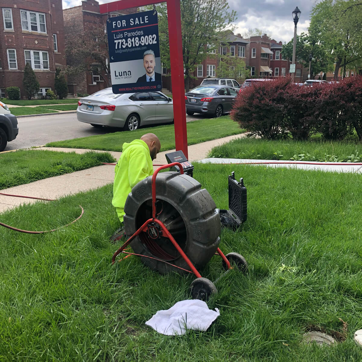 Worker Fixing Ground near hydro jet machine