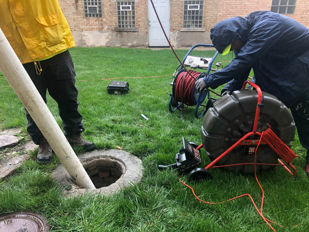 worker-setting-up-hydrojet Worker Setting Up Hydro Jet Machine