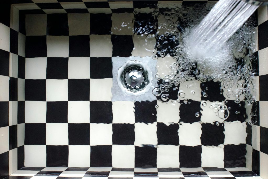 A clogged drain requiring drain cleaning in a sink in Chicago