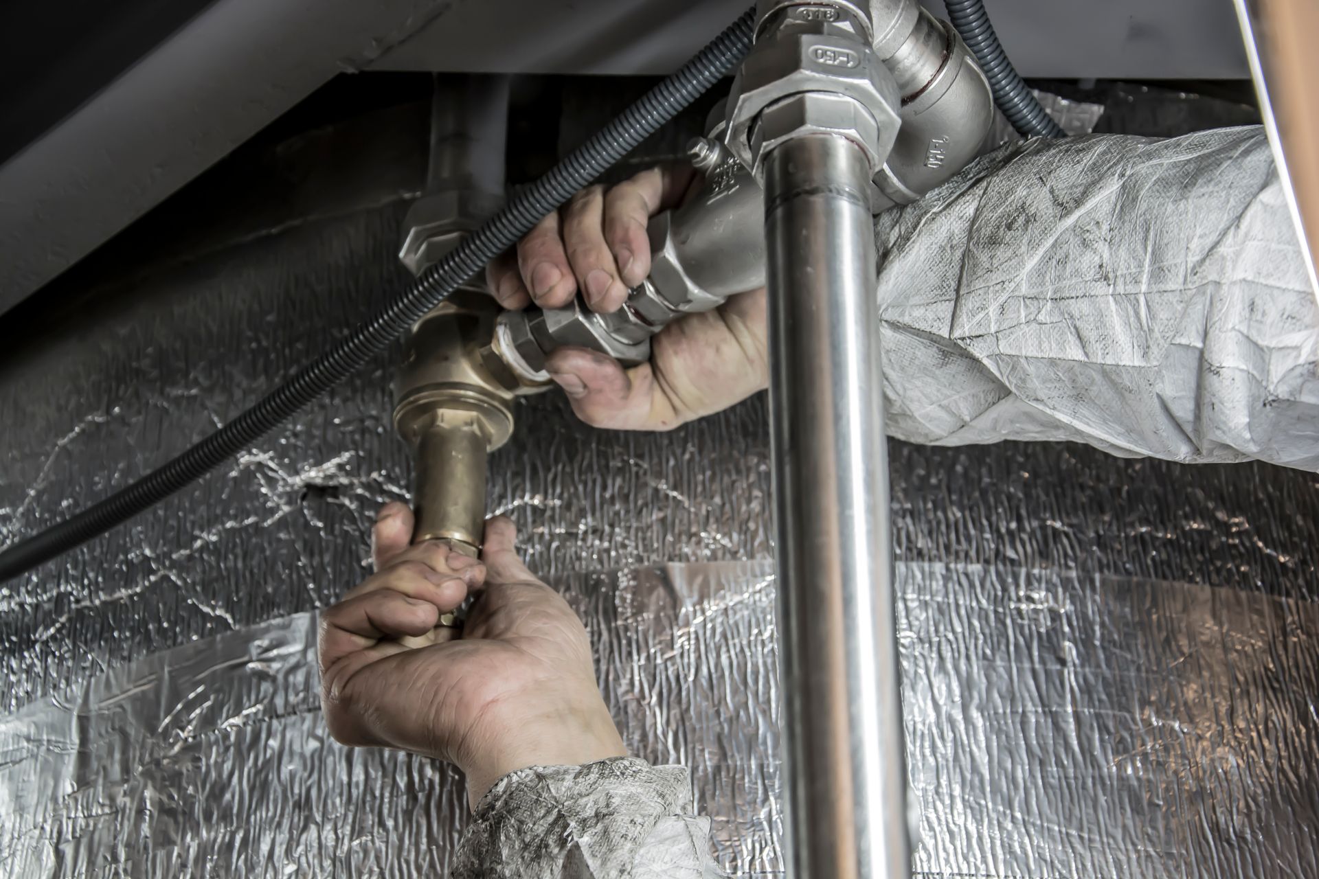 A professional plumber working on a clogged drain in Chicago