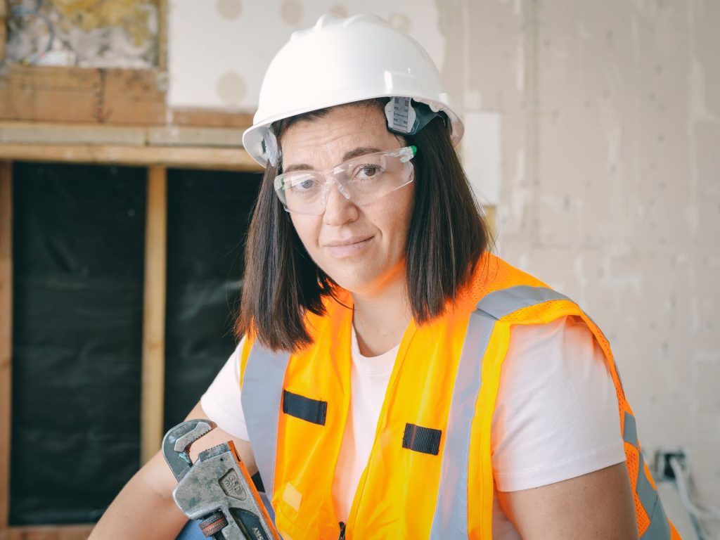 A professional plumber ready to check a sump pump in Chicago
