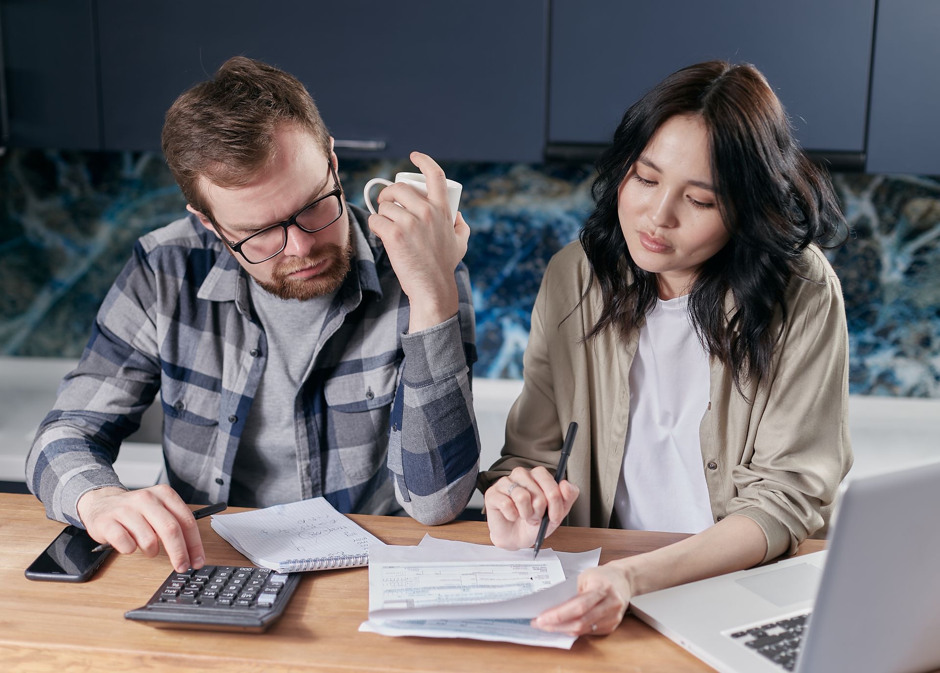 Two people looking at a budget for drain cleaning in Chicago
