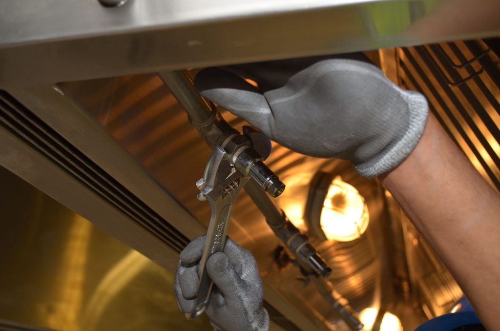 A professional plumber inspecting pipes in a home in Chicago